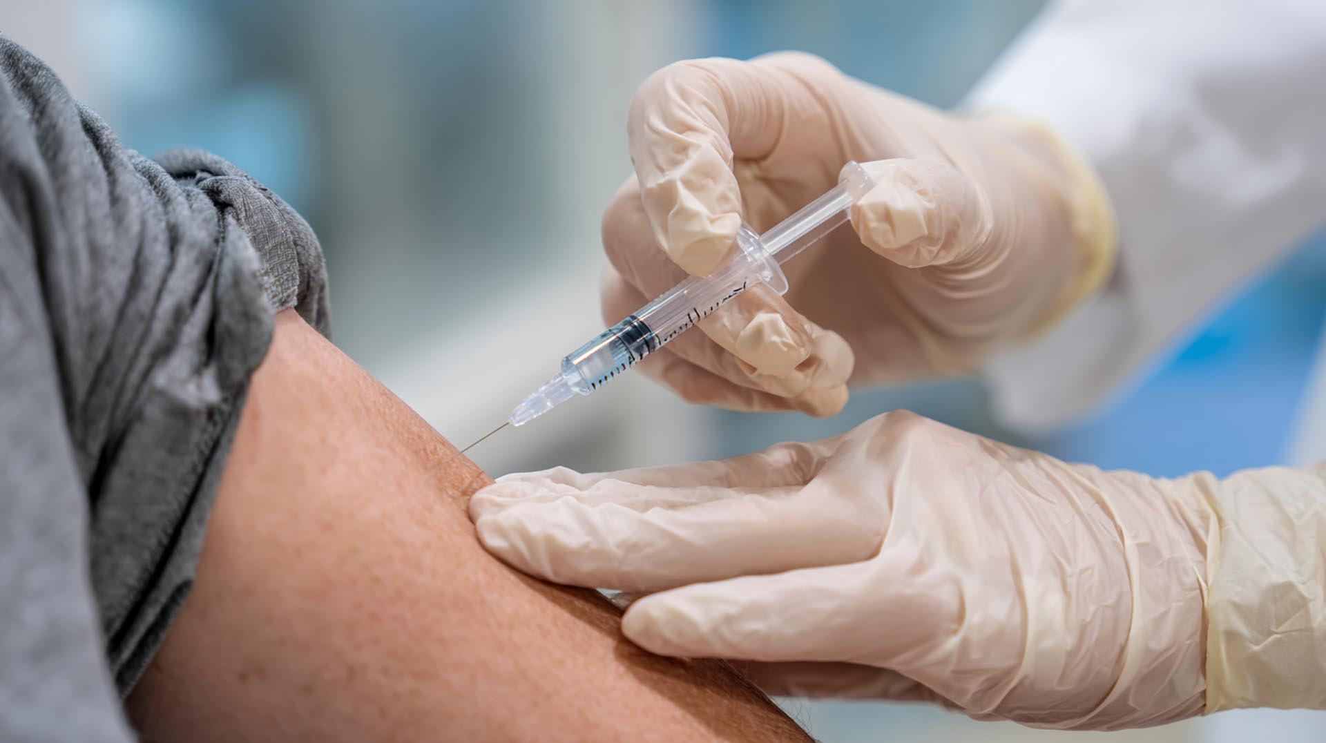 A nurse administers a biologic therapy for severe asthma, an advanced treatment covered in this pharmacological approach CE Nursing course.