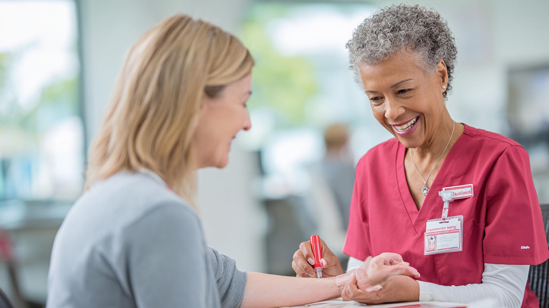 A provider reviews real-time data from a continuous glucose monitor, a modern technology discussed in the diabetes treatment CE Nursing course.